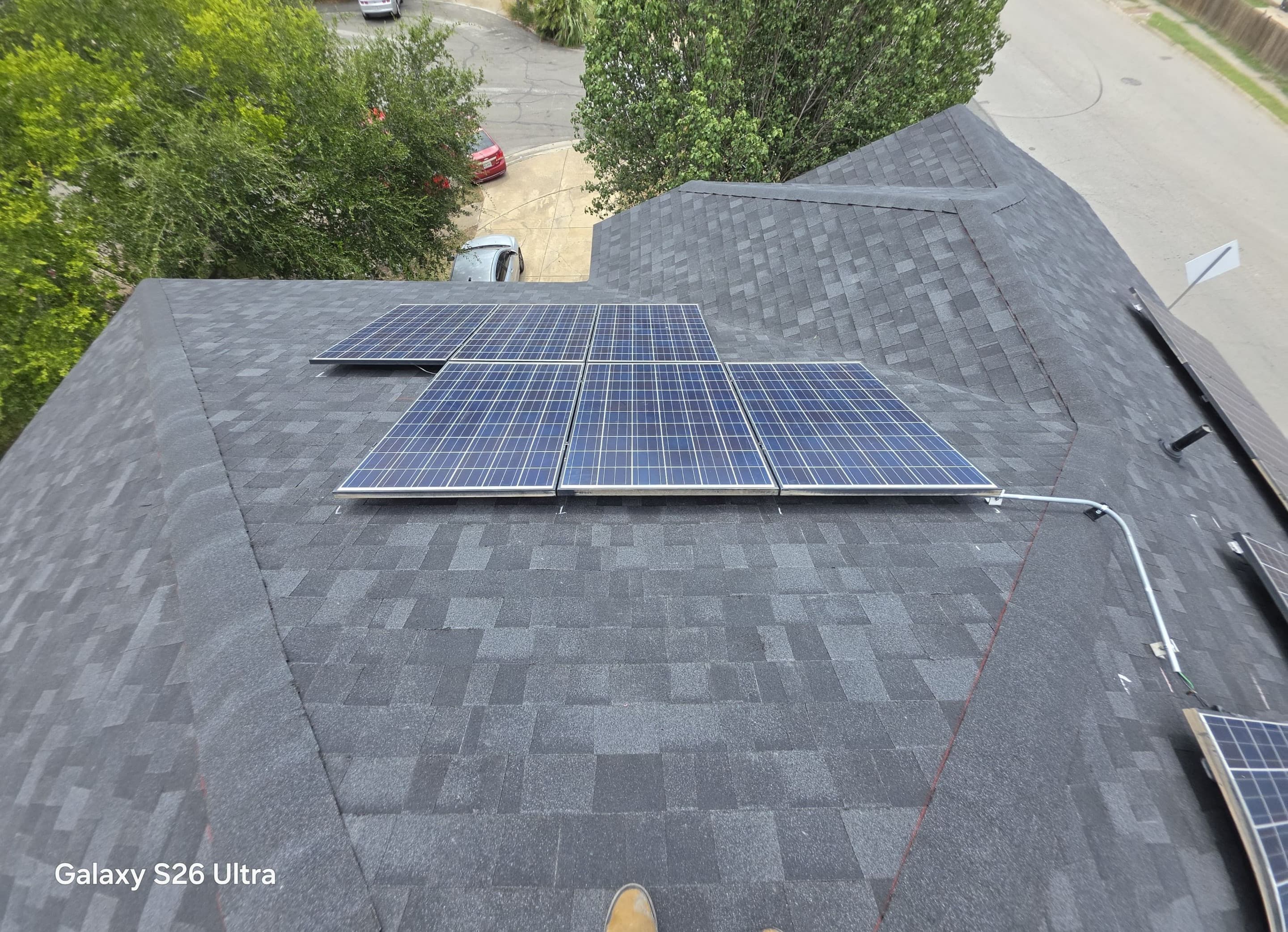 Documented solar array with conduit routing across a shingle roof