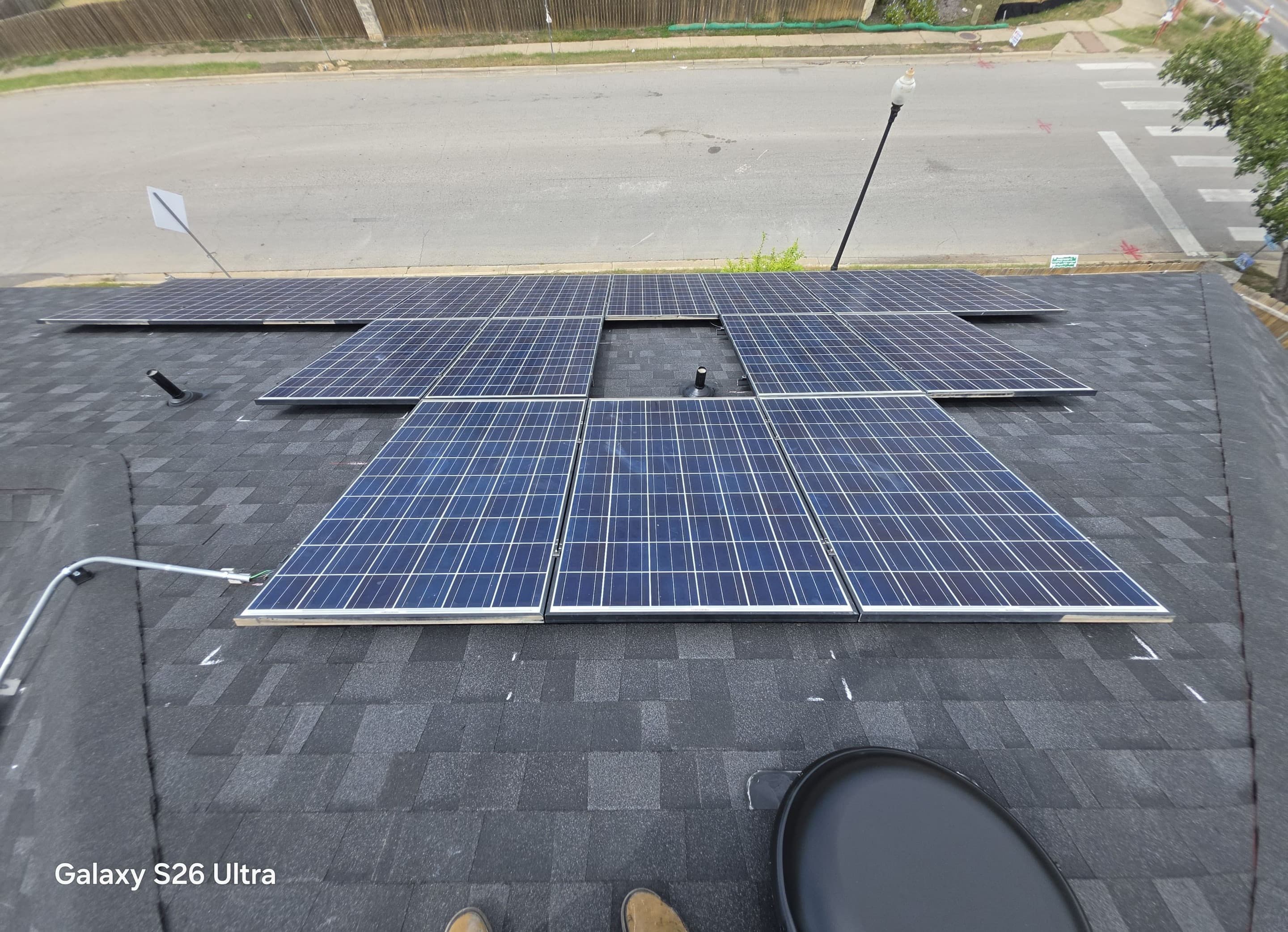 Partial solar array during reset with conduit and roof penetrations visible