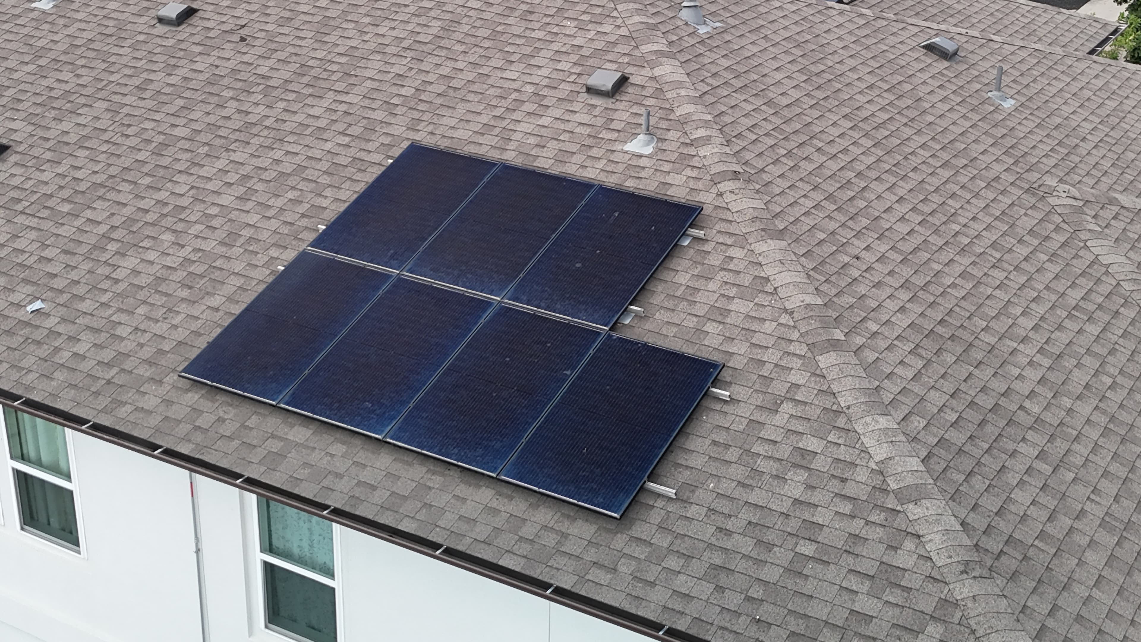 Existing rooftop solar array photographed in as-found field conditions
