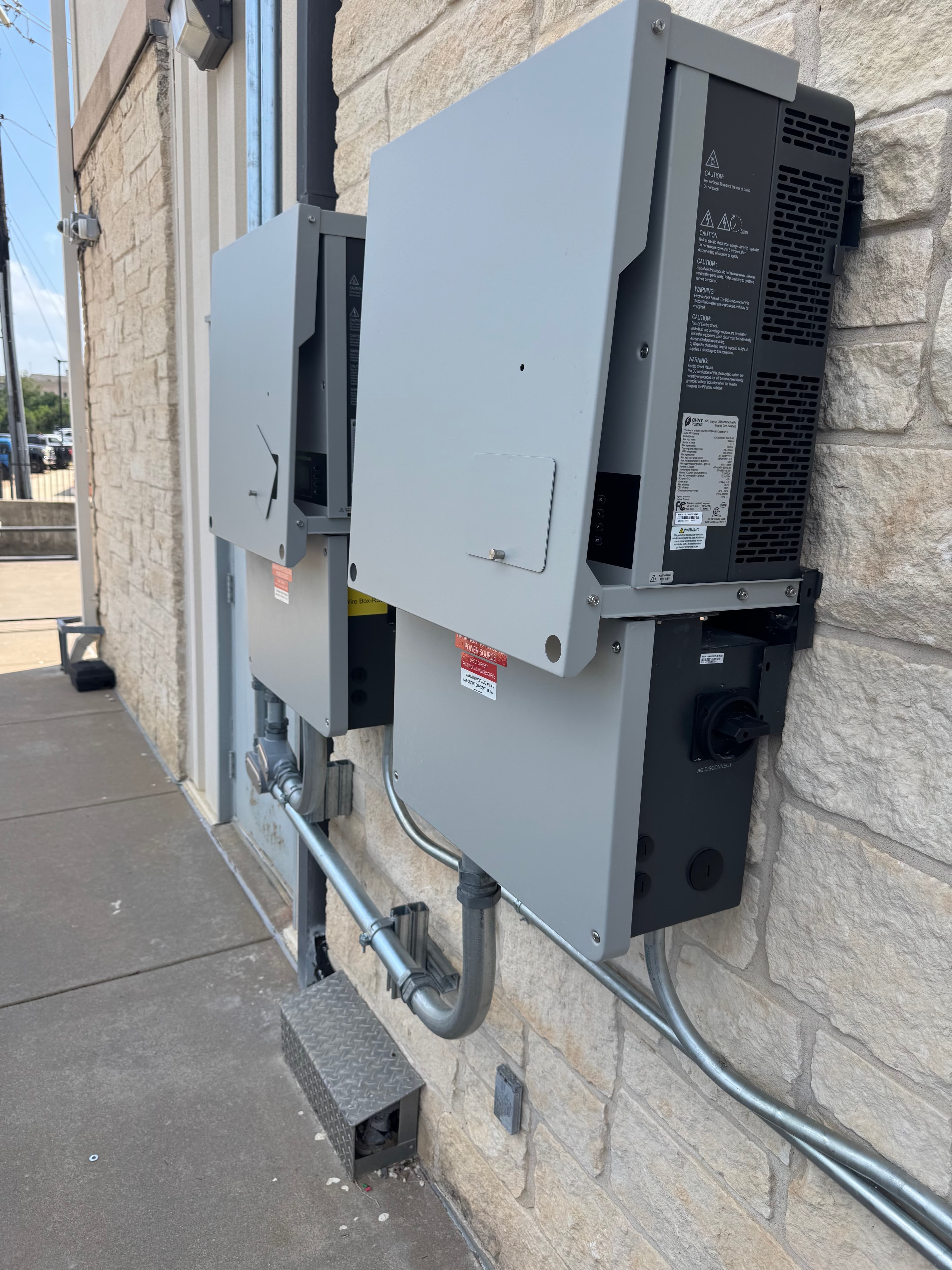 Dual commercial inverters with AC disconnect switches and equipment labels